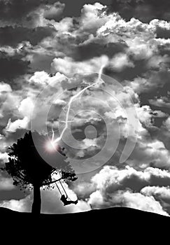 A girl swings in a tree swing under stormy clouds that release a lightning bolt that strikes the tree