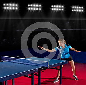 Girl table tennis player at sports hall