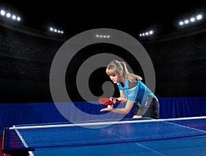 Girl table tennis player at sports hall