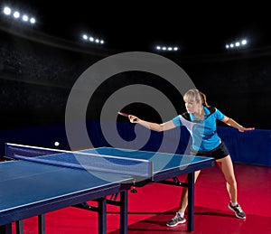 Girl table tennis player at sports hall