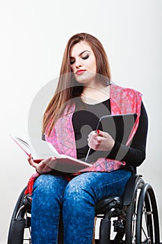 Girl with tabled and book.