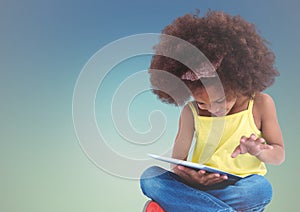 Girl with tablet against blue green background