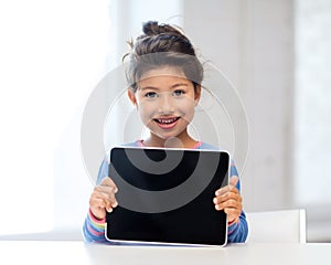 Girl with tablet pc at home