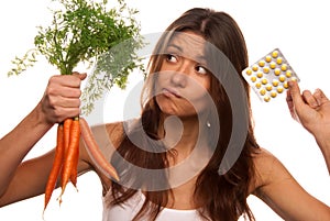 Girl with tablets and carrots