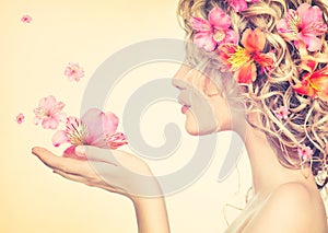 Girl takes beautiful flowers in her hands