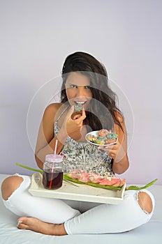 Girl takes a bite of a american donuts