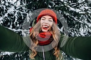 Girl takes funny winter selfie