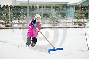 A girl takes pride in completing a shoveling job