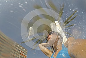 A girl takes a shower on magaluf beach in Majorca photo