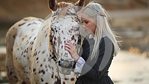 Girl taking care of her horse, Therapy with horses - hippo therapy - Image
