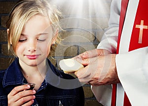 Girl taking Communion