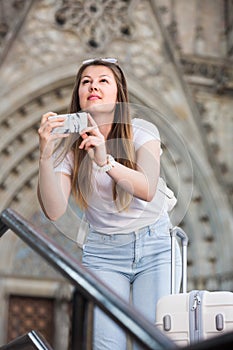 Girl is taking photo on her phone