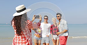 Girl Taking Photo Of People Group On Beach On Cell Smart Phone Happy Cheerful Man And Woman Posing Tourists On Vacation