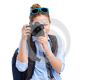 Girl taking picture using digital camera