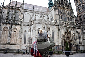 A girl taking pictures Cathedral of St. Elizabeth. lady traveling in Kosice, Slovakia