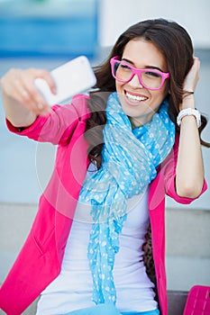 Girl taking pictures of yourself on your cell phone