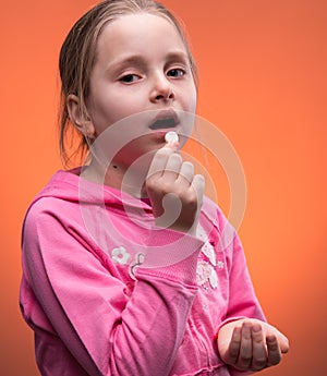 Girl taking pill