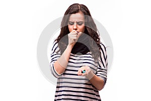 Girl taking pills from head pain,