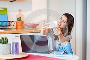 Girl taking a selfie with smartphone