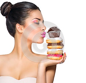 Girl taking sweets and colorful donuts