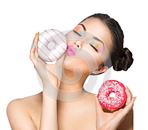 Girl taking sweets and colorful donuts