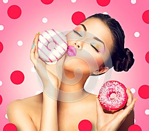 Girl taking sweets and colorful donuts