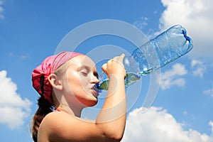 Girl taking a thirsty drink