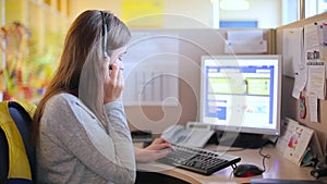 Girl talking with a client in a call center