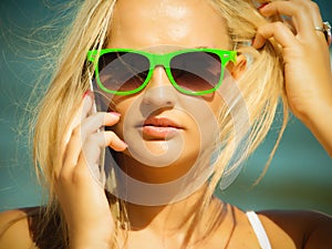 Girl talking on mobile phone on beach