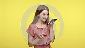 Girl talking to smartphone, using virtual assistant.