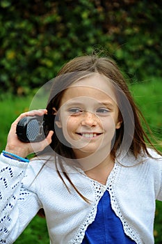 Girl talks on  walkie talkie