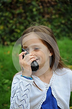 Girl talks on  walkie talkie