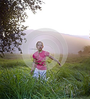 Girl in tall grass