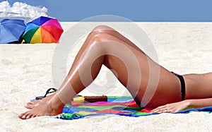 A girl tanning on the beach