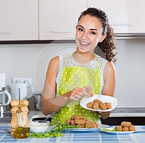 Girl with tasty breadcrumbed crocchette