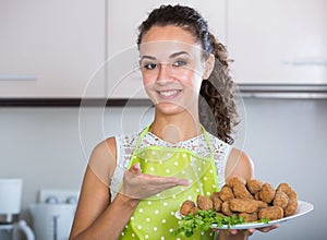 Girl with tasty breadcrumbed crocchette photo