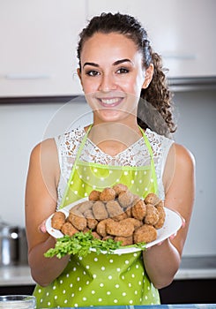 Girl with tasty breadcrumbed crocchette photo