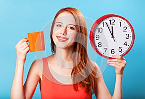 Girl with tea cup and clock