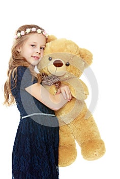 Girl with a Teddy bear.