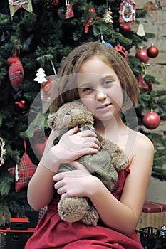 Girl with teddy bear in her hands