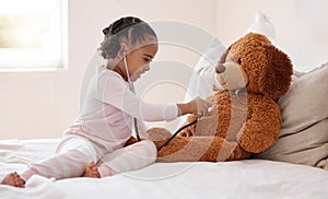 Girl, teddy bear and stethoscope in hospital game in medical, healthcare and wellness bedroom. Happy smile, curious