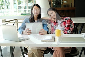 Girl teenager college high school student studying with tablet computer
