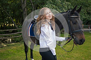 Girl teenager with a horse