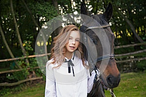 Girl teenager with a horse