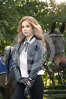 Girl teenager with a horse