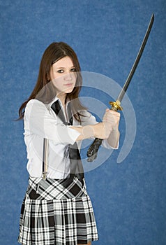 Girl - teenager menacingly brandishes a sword