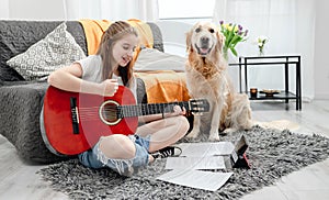 Girl teenager practicing guitar playing