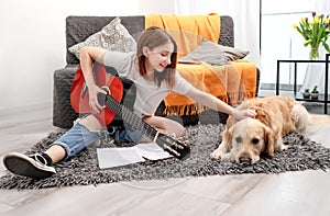 Girl teenager practicing guitar playing