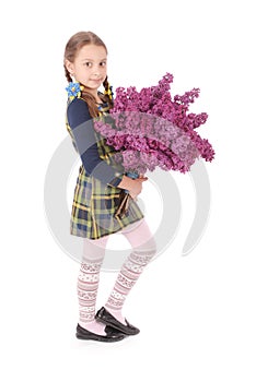 Girl teenager standing with lilac in hands