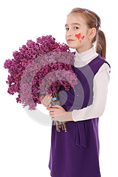 Girl teenager standing with lilac in hands